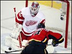  Detroit Red Wings goalie Jonas Gustavsson lets in a goal by Calgary Flames' Jay Bouwmeester.