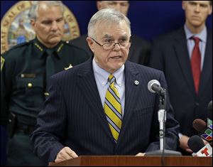 Gerald M. Bailey, Commissioner of the Florida Department of Law Enforcement at a news conference Wednesday, in Orlando. Florida's lieutenant governor resigned and nearly 60 other people were charged in a widening scandal of a purported veterans charity that authorities said was $300 million front for illegal gambling.