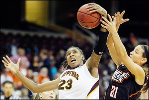 Central Michigan's Crystal Bradford beats Bowling Green's Chrissy Steffen for the rebound.