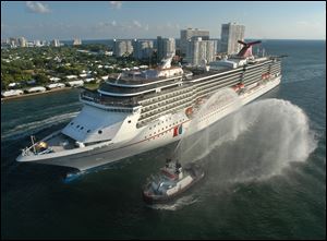 The Carnival Legend, a 2,100-passenger, 960-foot-long cruise ship arrives at Port Everglades in Fort Lauderdale, Fla.