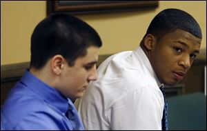 Trent Mays, 17, left, and co-defendant 16-year-old Ma'lik Richmond sit in court before the start of the third day of their trial on rape charges in juvenile court today in Steubenville, Ohio. 