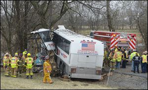 Emergency and rescue crews respond to the scene of a tour bus crash on the Pennsylvania Turnpike today near Carlisle, Pa.  