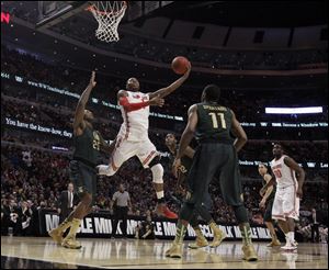 Ohio State's Deshaun Thomas goes up for a shot against Michigan State today at the United Center in Chicago.