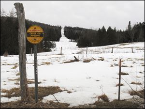 A sign indicates a section of a buried crude oil pipeline in Burke, Vt. Canadian energy officials insist they have no plans to reverse the flow of the pipeline that now carries crude oil from Maine to Montreal, but that has done little to reassure New England towns that are against the idea and the 18 members of Congress asking for a full environmental review.