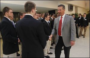Ohio State coach Urban Meyer shakes hands with high school football players honored at the National Football Foundation banquet at the Stranahan Theater.