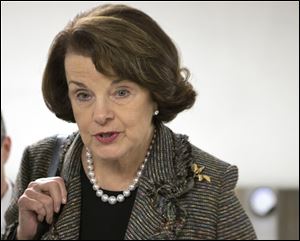 FILE - In this Feb. 25, 2013 file photo, Sen. Dianne Feinstein, D-Calif. speaks with reporters on Capitol Hill in Washington. Feinstein, the sponsor of a proposed assault weapons ban says Senate Majority Leader Harry Reid has told her that the ban will not be part of the initial gun control measure the Senate will debate next month. (AP Photo/J. Scott Applewhite, File)