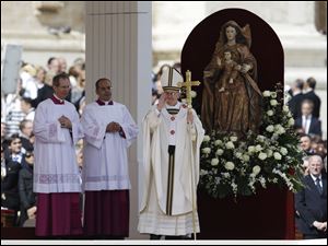 Pope Francis blesses the faithful in St. Peter's Square during his inauguration Mass at the Vatican.