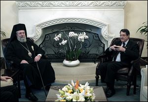 Following the talks with President Anastasiades, right, the head of Cyprus' influential Orthodox church Archbishop Chrysostomos II, left, said on today that he will put the church's assets at the country's disposal to help pull it out of a financial crisis.
