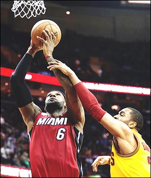 LeBron James posted 25 points, 12 rebounds, and 10 assists as the Heat rallied from a 27-point hole in the third quarter to win their 24th consecutive game.