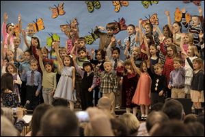 Kindergarten students preform together for family and friends.