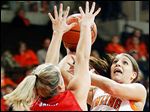  Bowling Green's Jillian Halfhill puts up a shot against  SMU's Korina Baker during a WNIT game at Bowling Green. Halfhill led the Falcons with 23 points. BG will plays Duquesne on Saturday.