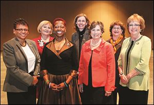 YWCA Milestone honorees were, from left, Linda Brown-Ewing, Teresa Fedor, Wanda Butts, Dr. Anne Towey Ruch, Patricia Kirchner Appold, Carolyn M. Putney, and Dr. Jane H. Robinson.