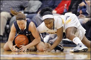 Butler's Mandy McDivitt, left, and UT's Lecretia Smith battle for the ball in Thursday night's WNIT game at Savage Arena.