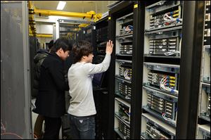In this photo released by Korean Broadcasting System, KBS employees try to recover a computer server a day after a cyberattack caused computer networks at the company to crash,  in Seoul, South Korea, today.