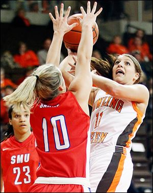 Bowling Green's Jillian Halfhill puts up a shot against  SMU's Korina Baker during a WNIT game at Bowling Green. Halfhill led the Falcons with 23 points. BG will plays Duquesne on Saturday.