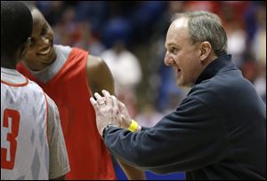 Ohio State head coach Thad Matta talks with his players during practice Thursday in Dayton, Ohio. Ohio State is scheduled to play Iona today.