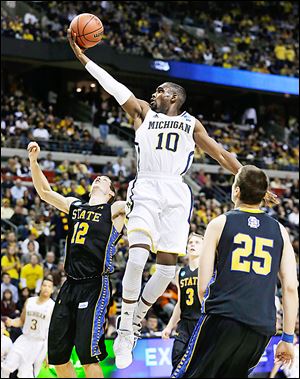 Michigan’s Tim Hardaway, Jr., and the Wolverines are expecting a high-pressure defense that forces turnovers from Virginia Commonwealth today in the team’s third-round matchup.