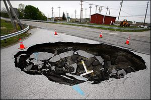 It can happen in this area too. In 2008, a large sinkhole at the intersection of State Rt. 64 and King Road closed Route 64 through nearby Haskins in Wood County.