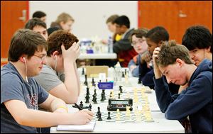Bowling Green High School student Nick Van Vorhis, left, and Perrysburg High School student Ben Hirt battle in the open section. Chess clocks and notation were required in open section matches. 