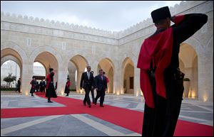 President Barack Obama and Jordan's King Abdullah II walk from an official arriveal ceremony at Al-Hummar Palace, the king's residence Friday in Amman, Jordan.