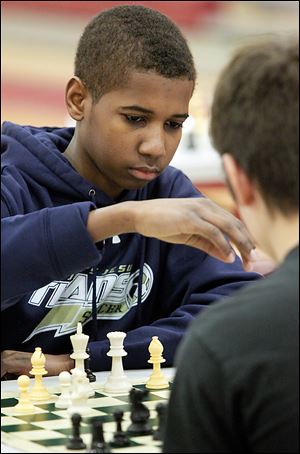 Brison Woods, a freshman at St. John’s Jesuit, prepares to move against Eli Barber, a Bowling Green home schooler.