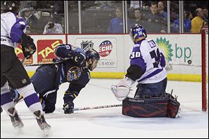 Trevor Parks goes flying during the third period against Reading. The Walleye outshot the visitors but were still shut out.