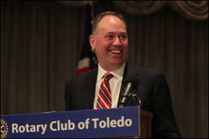 Mike Thaman gives an upbeat assessment of the direction of the housing market to the Toledo Rotary Club.