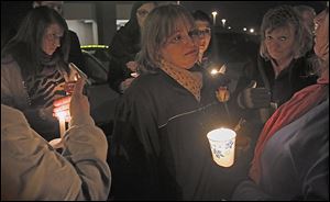 Jenny Gerber cries during the candlelight vigil for her daughter Kaitlin Gerber at the Southland Shopping Center in Toledo, where Miss Gerber was murdered by an estranged former boyfriend.
