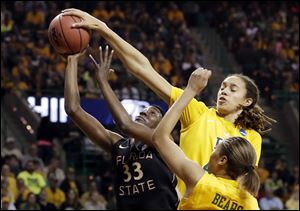 Florida State forward and Waite graduate Natasha Howard has her shot blocked by Baylor's Brittney Griner, right rear, as Alexis Prince, bottom, watches Tuesday in Waco, Texas.