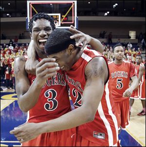Tony Kynard, left, and Clemmye Owens celebrate after Rogers defeated Brecksville-Broadview Heights in the Division I regional final. The Rams lost in the state championship game.