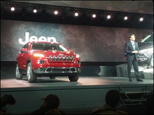 Mike Manley, Jeep brand Chief Executive, shows off the new 2014 Jeep Cherokee at the New York Auto Show.