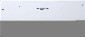 U.S. Air Force B-2 stealth bomber, center, flies over near the Osan U.S. Air Base in Pyeongtaek, south of Seoul, South Korea, today. A day after shutting down a key military hotline, Pyongyang instead used indirect communications with Seoul to allow South Koreans to cross the heavily armed border and work at a factory complex that is the last major symbol of inter-Korean cooperation.