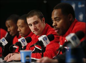 Ohio State's Aaron Craft, center, listens to Deshaun Thomas, right, during a news conference Friday in Los Angeles. Ohio State plays Wichita State in the West Regional finals of the NCAA college basketball tournament tonight.