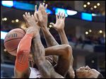  Ohio State forward Deshaun Thomas, left, and Wichita State forward Carl Hall get tangled up.