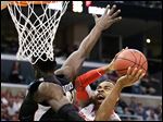  Wichita State center Ehimen Orukpe defends Ohio State forward Deshaun Thomas in the first half when the Buckeyes shot just 24 percent. OSU fell behind by 20 points in the second half before staging a furious rally that fell short. Ohio State finishes 29-8.