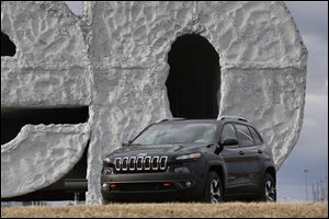 The company moved an all-new 2014 Jeep Cherokee in front of the Jeep sign after the vehicle made its debut in new York. About 350 vehicles have been produced so far, plant manager Zach Leroux said. 