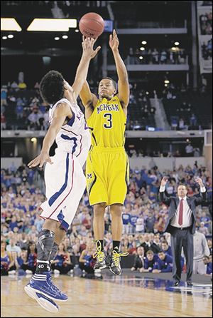 Michigan's Trey Burke puts up the 3-pointer that tied the game at the end of regulation. He finished with 23 points.