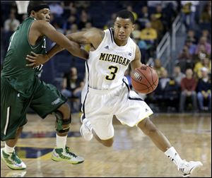Michigan guard Trey Burke, shown during this regular season game, was selected to the AP All-America team today. 