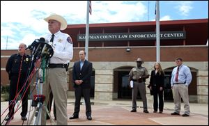 Kaufman County Sheriff David Byrnes, second from left, speaks at a news conference in Kaufman, Texas. 