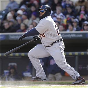 Detroit Tigers' Prince Fielder hits a double in the first inning of  an opening day baseball game against the Minnesota Twins in Minneapolis.
