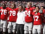  Ohio State offensive lineman Jack Mewhort, 74, joins coach Urban Meyer, and teammates, in the singing of 'Carmen Ohio,' following their game against Central Florida last season at Ohio Stadium in Columbus.