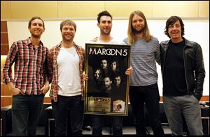 Members of Maroon 5, from left, Jesse Carmichael, Mickey Madden, Adam Levine, James Valentine and Matt Flynn, pose for photos. The Grammy-winning band announced Monday that they will headline the 2013 Honda Civic Tour, which kicks off Aug. 1 in St. Louis.