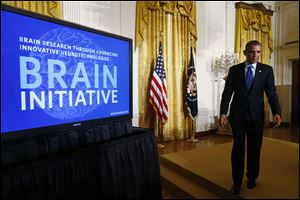 President Obama leaves the stage in the East Room of the White House in Washington after he spoke about the BRAIN (Brain Research through Advancing Innovative Neurotechnologies) Initiative. 