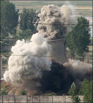 The cooling tower of the Nyongbyon nuclear complex is demolished in Nyongbyon, also known as Yongbyon, North Korea in June, 2008. North Korea vowed today  to restart a nuclear reactor that can make one bomb's worth of plutonium a year.