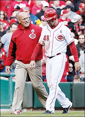 Reds left fielder Ryan Ludwick will require surgery after he dislocated his right shoulder.