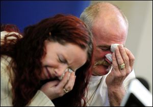 Mick Philpott, right, and wife Mairead react during a news conference in May, 2012, at Derby Conference Centre following a fire at their home  which claimed the lives of six of his children, Derby, England.