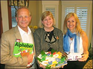 From left: Randy Oostra with Nancy Eames and his wife Barb.