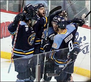 The Walleye celebrate a goal by Randy Rowe in a game at the Huntington Center. Toledo reached the ECHL playoffs for the first time since 2010.