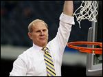 Michigan head coach John Beilein reacts after cutting down the net after a regional final victory against Florida. Beilein hopes to bring UM its first national championship since 1989.