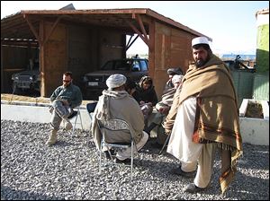 Vanessa Gezari, center, interviews elders in Zormat, Afghanistan, during her work in that nation.